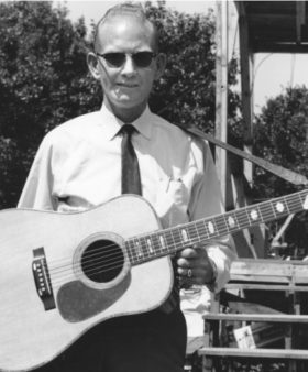 Red Smiley with his D45 Martin Guitar at the Roanoke Blue Grass Festival in Fincastle, Virginia 1965.