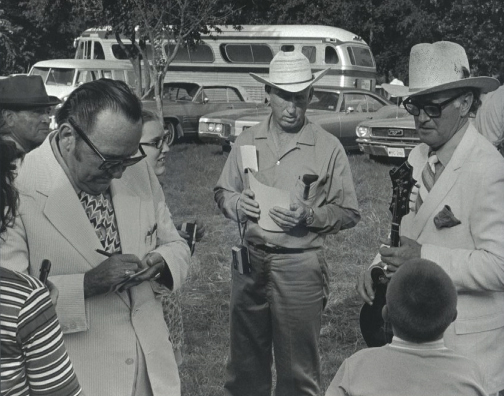 Lester Flatt and Bill Monroe signing autographs in Garland, Texas 1971